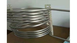How do you straighten coiled stainless steel tubing?